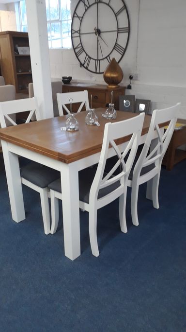 extending painted table set with 6 grey fabric seat chairs