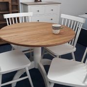Painted bistro set. Finished in old white with solid oak top. Round pedestal table and 4 stick back chairs £595